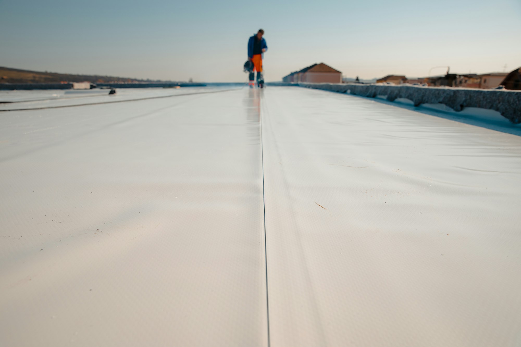 Waterproofing and insulation at construction site, Exterior vapor barrier for roof.