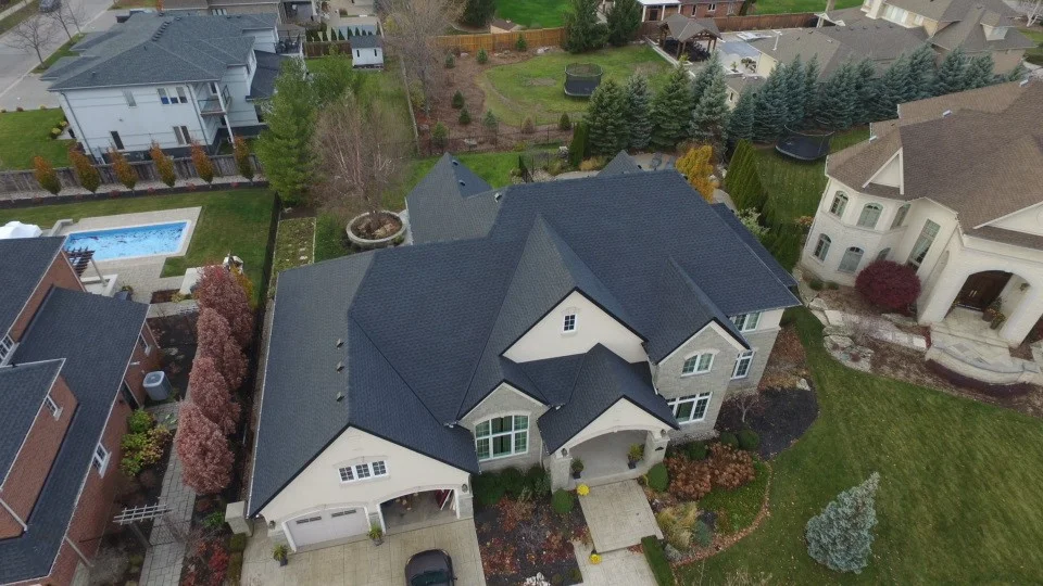 Full residential replacement showing roofing in Stoney Creek with GAF Timberline HDZ shingles in charcoal.